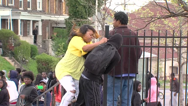 ORIGINAL: Mother drags son from Baltimore riots | youtube.com | 65400