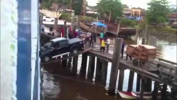 Car boarding a ship over a plank | 71783
